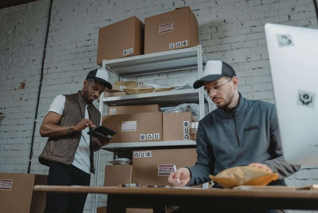 Man in Black Button Up Shirt Standing Beside Man in Gray Polo Shirt